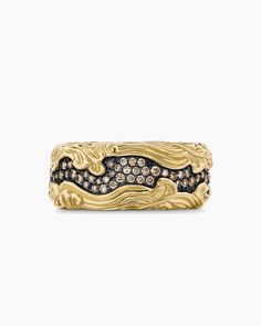 a gold ring with black and white diamonds on it's sides, set in 18k yellow gold