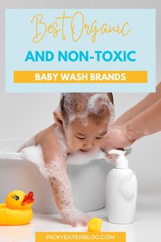 a baby is taking a bath in a tub with soap on it and the words best organic and non - toxic baby wash brands