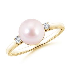 Versatile in design, this single pearl ring embodies subtle elegance. The round Akoya cultured pearl in white is peg set in between two prong-set diamond accents. The scroll work detailing on the gallery gives this pearl solitaire ring a distinctive look. Crafted in 14K yellow gold with a sleek band, this piece is a must have for the woman with a minimalistic sense of style. Pearl Wedding Ring Set, Akoya Pearl Ring, Pearl Wedding Ring, Dream Wedding Ring, Cultured Pearl Ring, Pearl Rings, Single Pearl, Freshwater Pearl Ring, Scroll Work