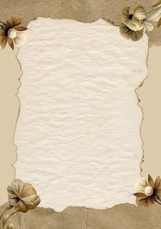 an old torn piece of paper with flowers and leaves on the edges is shown in this image