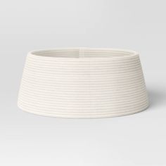 a white lamp shade on a gray background