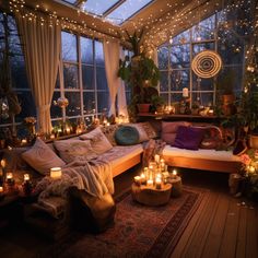 a living room filled with lots of candles and lights on the windows sill above it