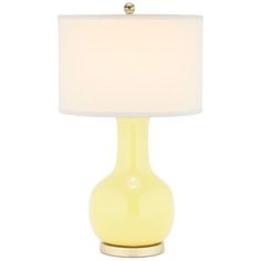 a yellow table lamp with a white shade