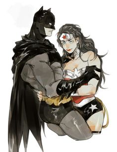 batman and batgirl hugging each other with their arms around one another, both dressed in costumes