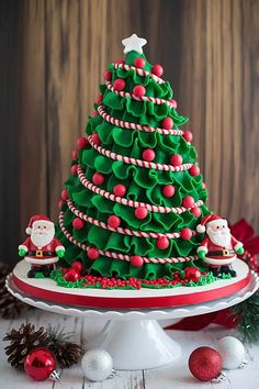 a decorated christmas tree cake on a platter