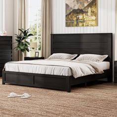 a bedroom with a bed, night stand and nightstands in black wood finish material