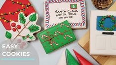 decorated christmas cookies on a cutting board with the words easy cookie ideas for santa claus north pole