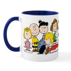 a blue and white coffee mug with a cartoon image of three people sitting on a bench