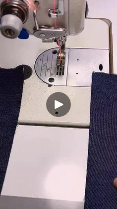 someone is using a sewing machine to sew something