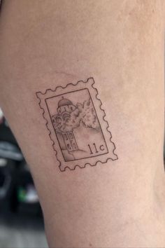 a stamp with an image of a lighthouse on it's side is shown in black ink