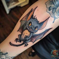 a tattoo with a dragon on it's arm