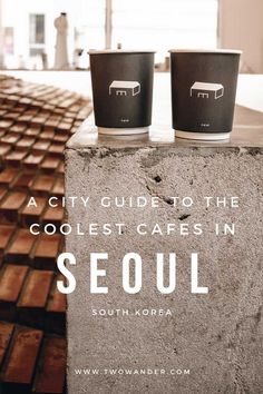 two cups sitting on top of a cement block with the words, a city guide to the coolest cares in seoul