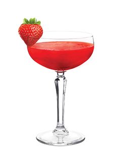 a red drink in a wine glass with a strawberry on the rim and garnish