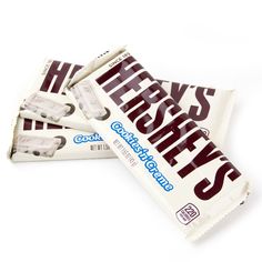 three bars of herss chocolate sitting next to each other on a white table top