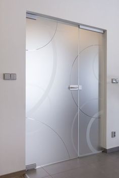 an open glass door in a white room