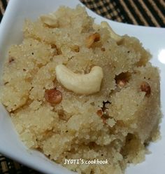 a square white plate topped with rice and nuts