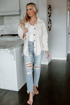 Invite this timeless layering piece into your wardrobe in our "Strike A Cord" button down shirt jacket. This cream shacket is secured with front button closures. Designed with bust pockets and button cuffs. Styled with the " Taryn" high rise mom jeans for a sleek effortless look. PRODUCT DETAILS: Front Button Closures Not Lined Colors May Vary Patterns May Vary CONTENT + CARE: Machine Wash Cold, Tumble Dry Low SIZE + FIT: Model: Model is 5'7" and wearing a Size Medium Fit: This garment runs smal Cord Shacket Outfit Women, Cord Shacket Outfit, Cream Shirt Jacket Outfit, White Cord Jacket Outfit, Short Shacket Outfit, White Corduroy Shacket Outfit, Cord Shirt Outfit Women, White Courderoy Jacket Outfit, White Shirt Jacket Outfit