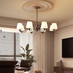 a living room filled with furniture and a flat screen tv mounted to the side of a wall