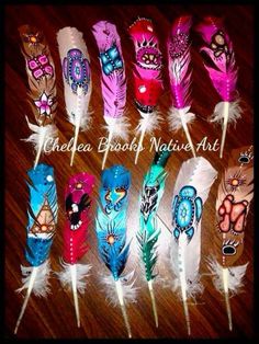 six different colored feathers with designs on them and the words cheeta bhasi native art