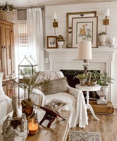 a living room filled with furniture and a fire place in front of a white fireplace