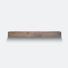 a wooden shelf with two holes in it