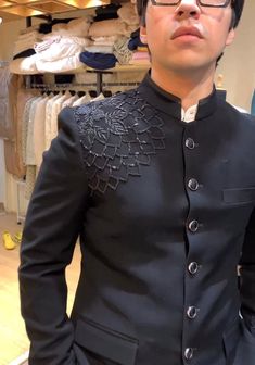 Make an edgy statement with our BLACK EMBROIDERED suit designed thoughtfully for the modern  man. A fusion staple fit for every occasion, adds the right amount of cultural twist to the western silhouette. Color: Black  Garment Type: Indo Western Neck: Mandarin Collar Fabric: Micro Velvet Embroidery: Zari work with sequin embroidery The Product Price is inclusive of: 1 Indo-Western and 1 Trouser Style Bottom and 1 shirt Product color may slightly vary due to photographic lighting sources or your screen settings. ~We provide fully stitched outfits as per your measurements ~Outfits can be customised in any colours For customisation please contact  ~We provide worldwide shipping ~You choose we design. ~High quality dresses no replicas only hand embroidery ~Image is only for reference purpose ~ Jodhpuri Work For Men, Black Jodhpuri, Black Embroidered Fitted Nehru Jacket, Designer Bandhgala For Groom, Winter, Designer Bandhgala For Groom Winter Ceremonies, Designer Bandhgala For Groom In Winter, Designer Bandhgala For Groom Winter Wedding, Designer Black Bandhgala With Intricate Embroidery, Black Embroidered Bandhgala For Ceremonial Occasions