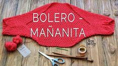 a red knitted sweater with the words bolero - mananita on it