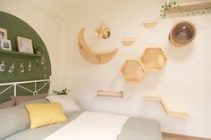 a bed room with a neatly made bed and wooden shelves on the wall above it