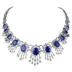 The Following Item we are offering is a Rare Important Spectacular and Brilliant White Gold Large Gorgeous Fancy Blue Sapphire Diamond Draped Necklace. Necklace consists of Rare Fine Magnificent Glittering Blue Sapphires and Gorgeous Diamonds! T.C.W. Over 60CTS!!! Can be purchased with a Pair of Matching Earrings separately (see photo 2 and photo 3). This Magnificent Necklace is a Rare Sample Necklace from a Private Top Manufacturer that sold to Five Store Hotels and Fine Jewelry Stores around t Luxury Blue Engraved Necklaces, Luxury Blue Delicate Jewelry, Fancy Items, Sapphire Diamond Necklace, Bridal Diamond Necklace, Princesa Real, Art Jewelry Design, Jewelry Design Drawing, Blue Sapphire Diamond