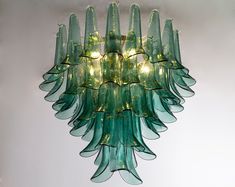 a green chandelier hanging from the ceiling