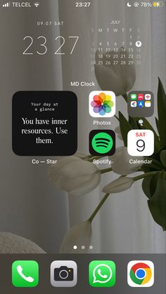 an iphone screen with flowers and calendars on it