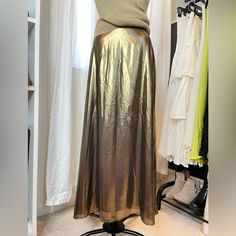 Aritzia Wilfred Liquid Gold Midi Skirt Size 6 Lined Back Zipper And Hook Closure Excellent Condition! Never Worn Too Big For Me. Waist Is About 13” Laying Flat Metallic Flared Skirt For Night Out, Metallic Lined Skirt For Summer, Gold Flowy Skirt For Party, Gold Skirt For Fall Evening Events, Gold Skirt For Evening Fall Events, Gold Skirt For Evening And Fall Season, Metallic Flared Skirt For Spring, Gold Long Skirt For Evening, Gold Skirt For Spring Formal Occasion