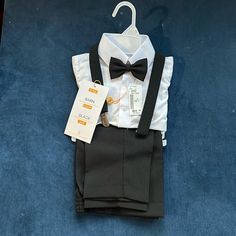 4 Piece Toddler Tuxedo With Shirt, Pants, Suspenders, And Bow Tie. Never Been Worn. Purchased Two Sizes And Forgot To Return One. Fits Equivalent To 2t. Toddler Tuxedo, Baby Tuxedo Shirt, Black Suit Dress, Tuxedo Colors, Shark Tee, Farm Clothes, Valentine Dress, Long Sleeve Outfits, Ruffle Romper