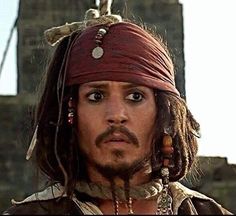 johnny depple as captain jack sparrow in the movie pirates of the carraige