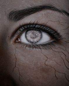 a woman's eye with water all over it