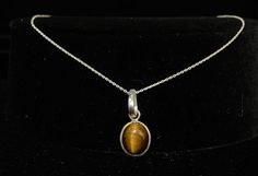 925 Sterling Silver Natural Tiger Eye Pear Gemstone Necklace Pendant. Gemstone Name: Natural Tiger Eye Metal: 925 Sterling Silver Quantity: 1 Pc Note: Due to the natural formation of this gemstone. Slight variation in design and color are to be expected. Tiger eye:- It inculcates and fosters self esteem in its wearer. Tiger eye stone enhances the strength of bones along with many other healing benefits. Tiger eye benefits include its ability to increase focus and self confidence in its wearer. It helps to cure disease related to skin, eyesight, and spinal cord. It is quite beneficial for the people having their birthdays with numbers 2 or 7. It is believed to ward off the evil eyes from the wearer. It also keeps away the evil spirits and gives immense self confidence to its possessor. Tige Tiger Eye Benefits, Shy People, Eye Pendant Necklace, Chakra Racine, Tigers Eye Necklace, Spinal Cord, Solar Plexus Chakra, Eye Pendant, Tiger Eye Stone