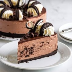 a slice of chocolate cheesecake with oreo cookies on top