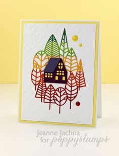 a card with a house and trees on it