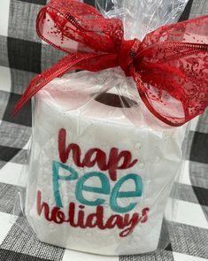 a gift wrapped in plastic with the words happy free holidays on it