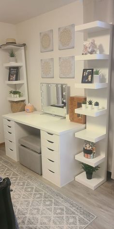 a white desk and shelves in a room