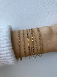 These minimalist bracelets look great alone or layered with your favourites! There are  eight options to choose from and some come in gold or silver. D E T A I L S  *All the chains featured are stainless steel which does not tarnish or oxidise and is also amazingly hypoallergenic. *Length: Choose the length you prefer  from the drop down menu. Use the length chart as a guide. *Click on the options and each one corresponds to a photo. *If you want more than one bracelet you can add them into your cart one at a time. *Choose the length guide as a reference. If unsure you can opt to have an extender added. C A R E * T I P  Stainless steel is very hard wearing but  to keep it in great condition please avoid contact with water, harsh chemicals and chlorinated (pool) water that can take a toll o Gold Jewelry Layered, Minimalist Bracelets, Mens Stretch Bracelets, Bracelet Layering, Gold Aesthetic, Jewelry Accessories Ideas, Bracelet Dainty, Dainty Chain, Silver Chain Bracelet