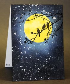 a card with two birds sitting on a tree branch in front of a full moon