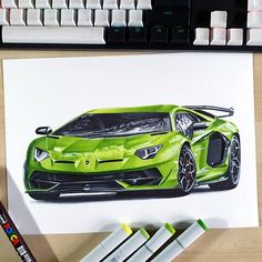 a drawing of a green sports car next to some crayon markers and a keyboard