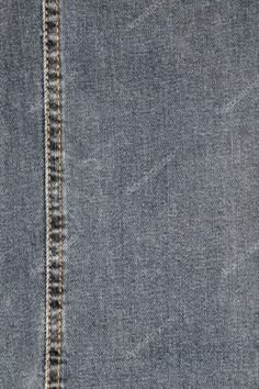 the back side of a pair of jeans with stitching on it and an open pocket