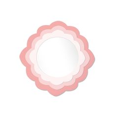 a pink flower shaped mirror on a white wall