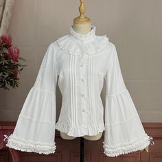 This price is for a shirt only, others are not included. Collar:Ruff CollarDress / Top Details:Front Button Placket / Lace Trim / Pleating Details / Ruffle TrimMaterial:Cotton / PolyesterSleeves:Balloon Sleeves / Bell Sleeves / Tie Closures Cuffs Size S M L XL 2XL Shoulders 35 36 37.5 39 40.5 Bust 84 88 92 96 100 Waist 70 74 78 82 86 Sleeve Length 59 60 61 62 63 ... Ruffles Sleeves, Kawaii Y2k, Poofy Dress, Ruff Collar, Big Sleeves, Blouses Women, Turtleneck Long Sleeve, Log Book, Shirts Black