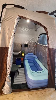 an inflatable tent with a pool inside