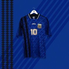 a soccer jersey hanging up against a blue and black striped wall with the number 10 on it