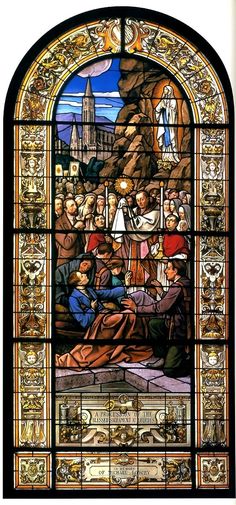 a stained glass window depicting the birth of jesus