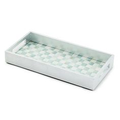 a white and green checkered tray on a white background